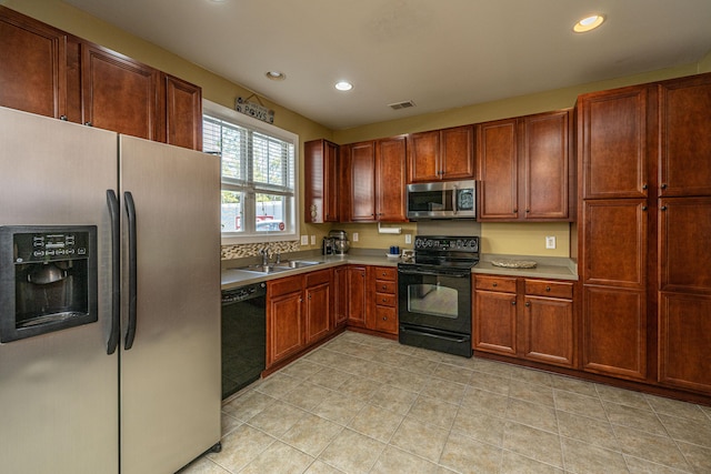 kitchen with black appliances and sink