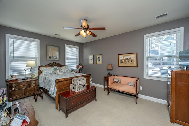 bedroom featuring ceiling fan and light colored carpet