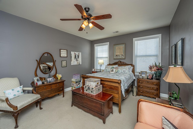 bedroom featuring ceiling fan and light carpet