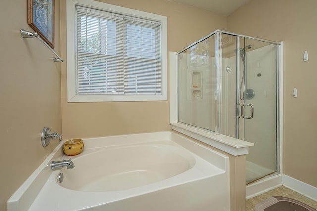 bathroom featuring separate shower and tub and tile patterned floors