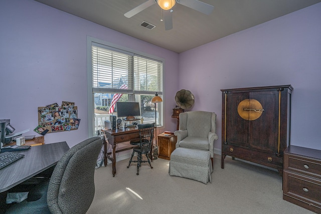 office space featuring ceiling fan and light carpet