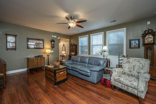 living room featuring dark hardwood / wood-style floors and ceiling fan