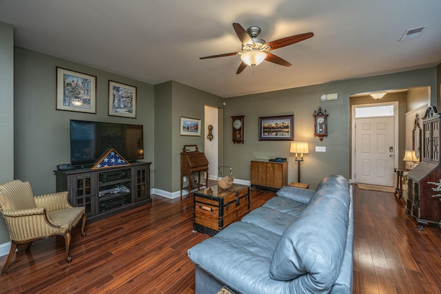 living room with dark hardwood / wood-style floors and ceiling fan