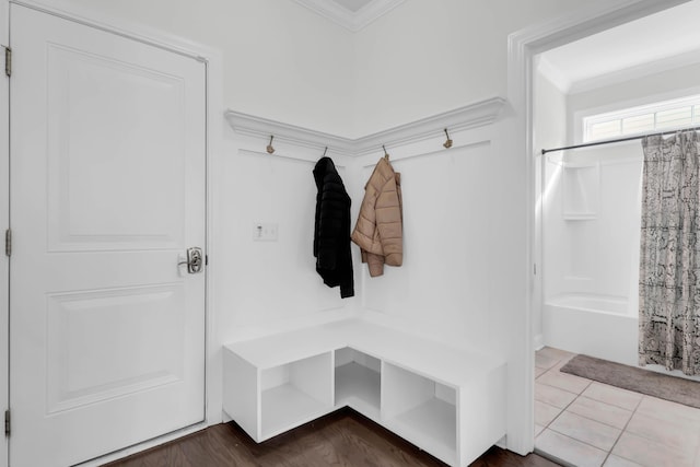 mudroom featuring tile patterned flooring and ornamental molding