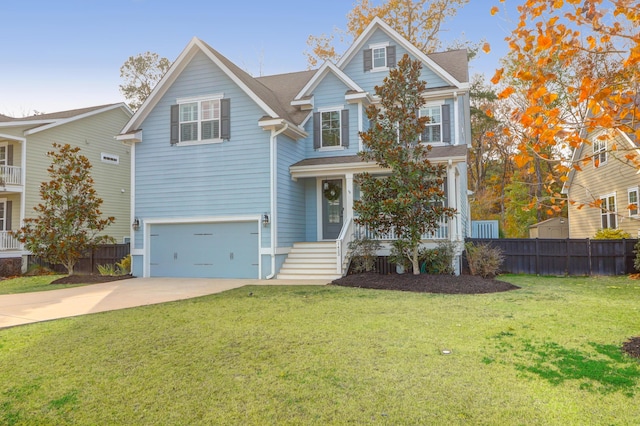 view of front of house with a garage and a front lawn