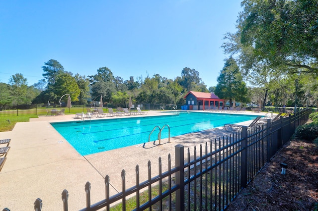 view of swimming pool with a patio area