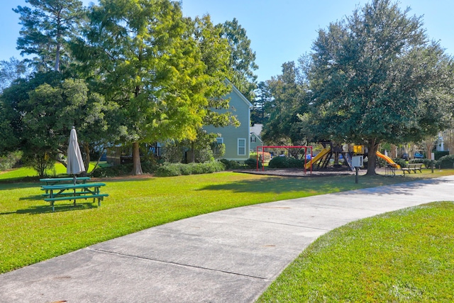 surrounding community featuring a yard and a playground