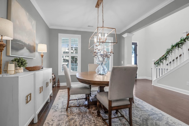 dining area with decorative columns, crown molding, and dark hardwood / wood-style floors