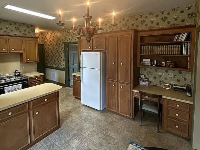 kitchen with an inviting chandelier, white fridge, and black range with electric stovetop