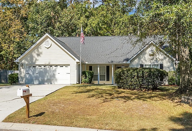 ranch-style home featuring a garage and a front yard