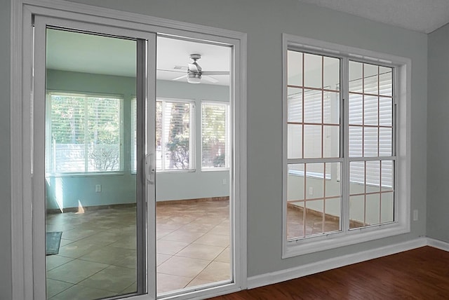 entryway with hardwood / wood-style floors and ceiling fan