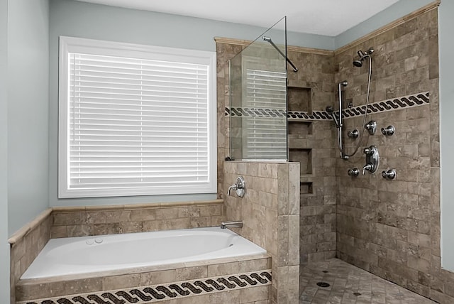 bathroom featuring shower with separate bathtub