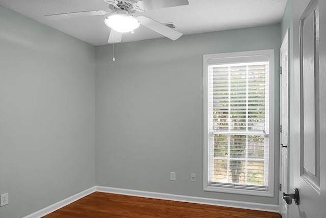 unfurnished room with hardwood / wood-style floors and ceiling fan