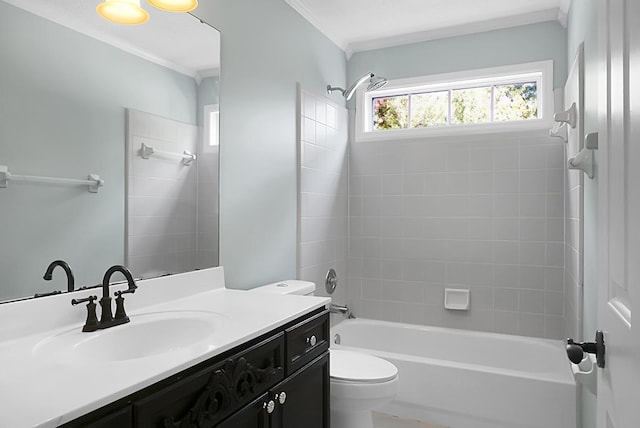 full bathroom with vanity, tiled shower / bath combo, and toilet