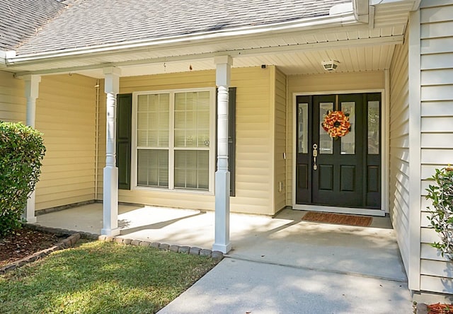 entrance to property with a porch