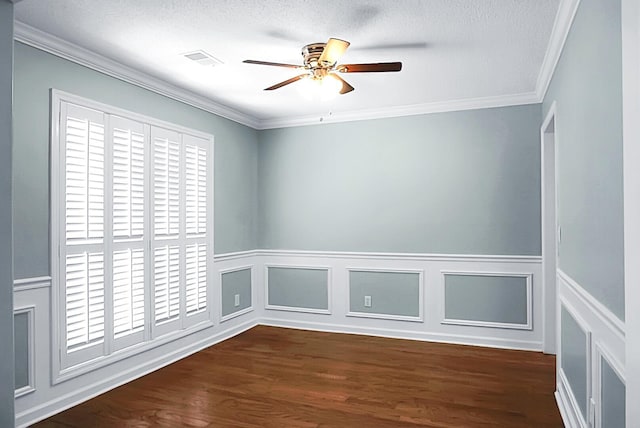 spare room with crown molding, ceiling fan, dark hardwood / wood-style floors, and a textured ceiling