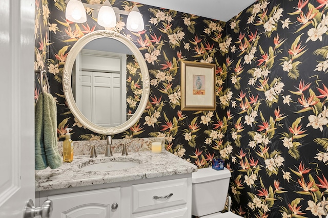 bathroom with vanity and toilet