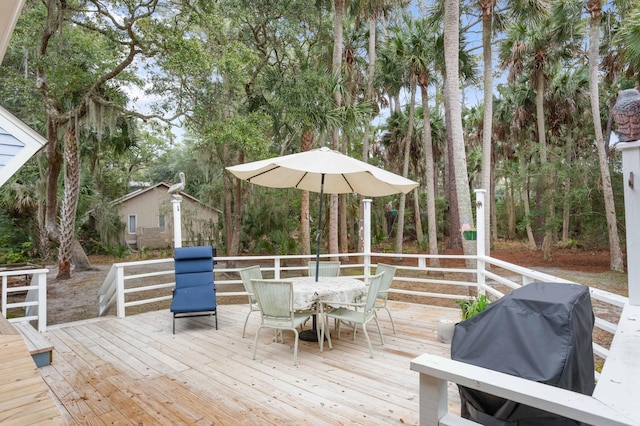 wooden terrace with area for grilling