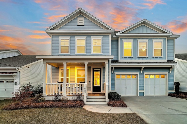 view of front of home featuring a garage and covered porch