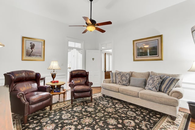 living area with ceiling fan and wood finished floors