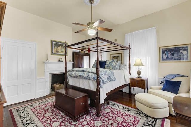 bedroom with lofted ceiling and wood finished floors