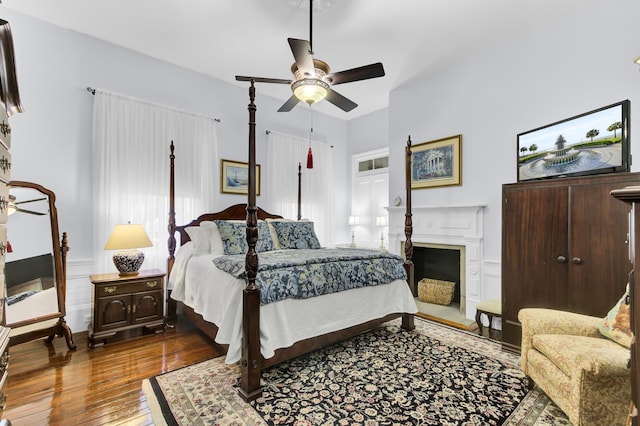 bedroom featuring ceiling fan and hardwood / wood-style floors