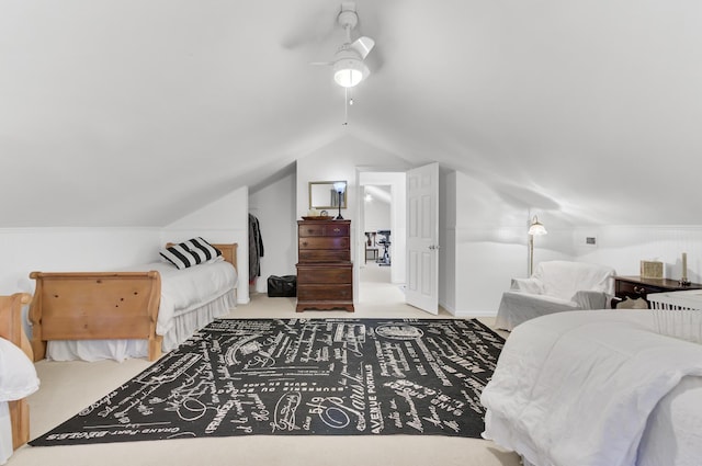 bedroom featuring carpet flooring, a ceiling fan, and lofted ceiling