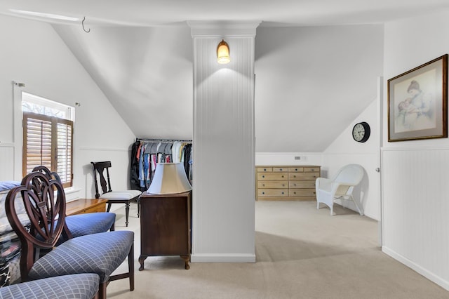 interior space featuring carpet flooring and lofted ceiling