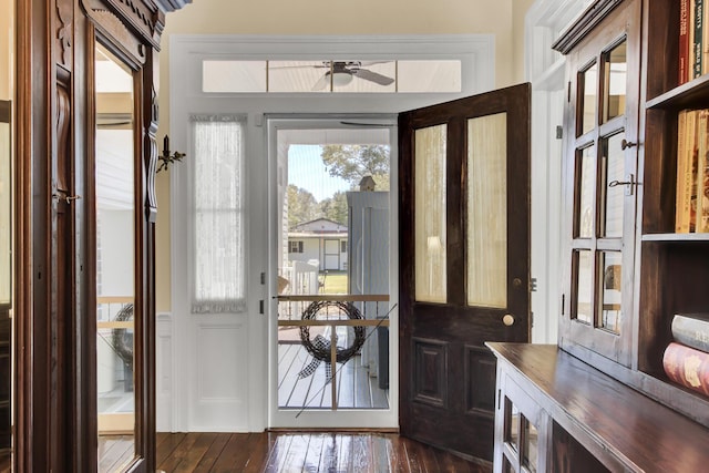 foyer featuring dark wood-type flooring and ceiling fan