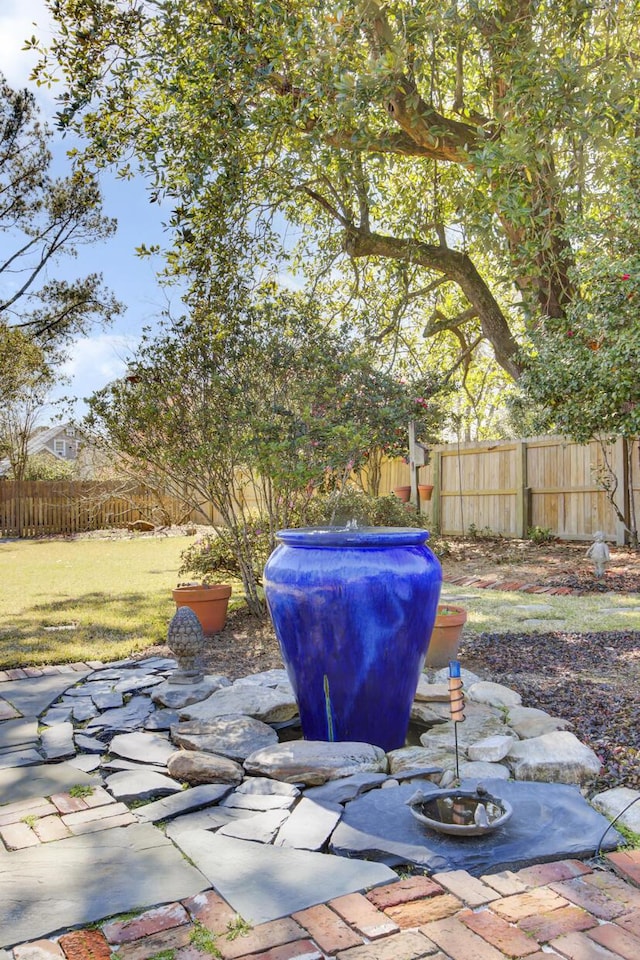 view of patio featuring fence