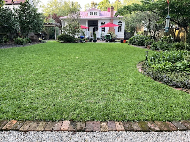 view of yard with a patio and a pergola