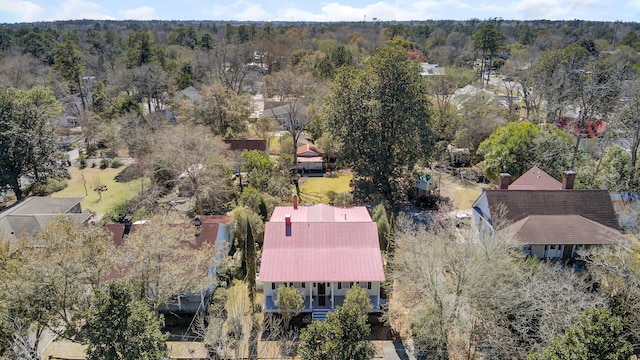 drone / aerial view featuring a view of trees