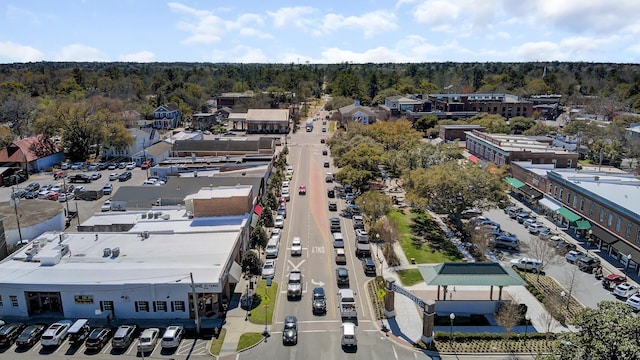 bird's eye view with a wooded view