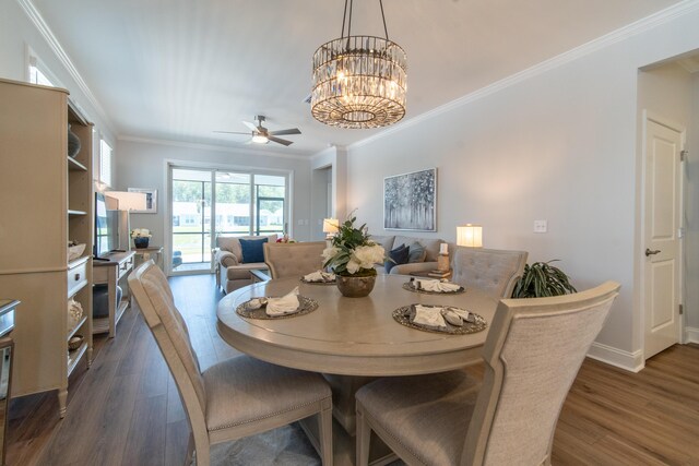 754 Blue Iris Way, Summerville, SC 29486 - dining area featuring crown molding, dark wood-style floors, a ceiling fan, and a chandelier