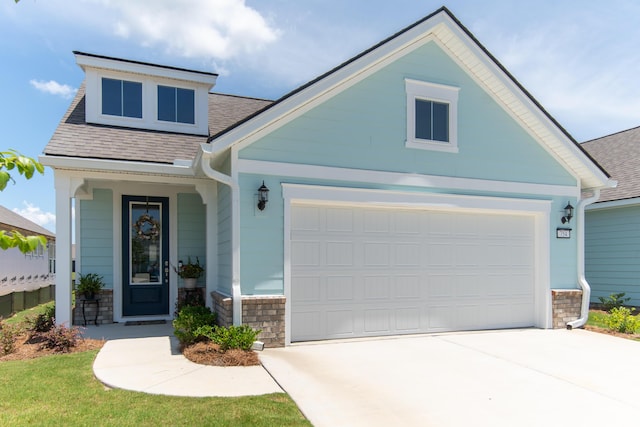 754 Blue Iris Way, Summerville, SC 29486 - view of front of property featuring roof with shingles, stone siding, driveway, an attached garage, and a porch