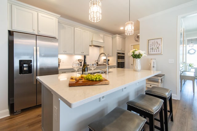 754 Blue Iris Way, Summerville, SC 29486 - kitchen featuring stainless steel appliances, a chandelier, backsplash, dark wood finished floors, and ornamental molding
