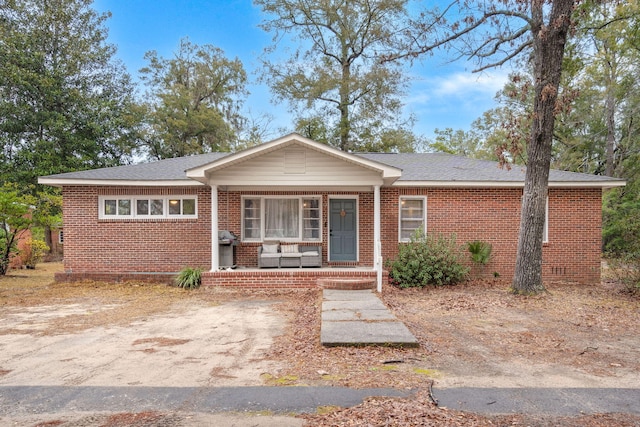 ranch-style home featuring a porch