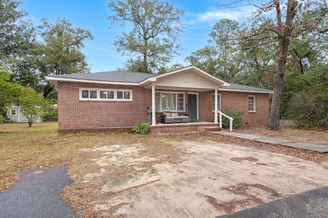 ranch-style home featuring a porch