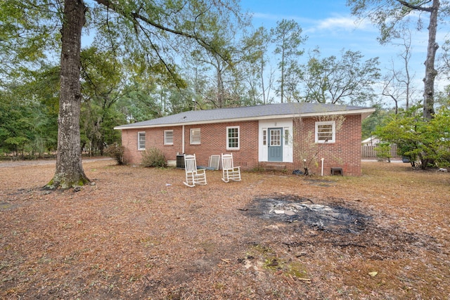 rear view of house with central AC