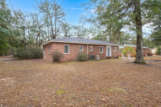 back of house featuring central air condition unit