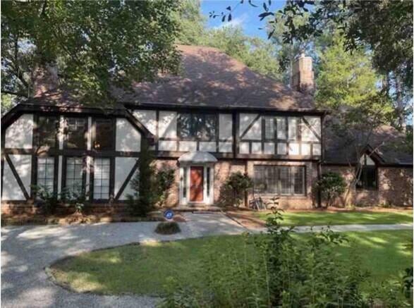 104 Legend Oaks Way, Summerville, SC 29485 - english style home featuring driveway, a front lawn, and a chimney
