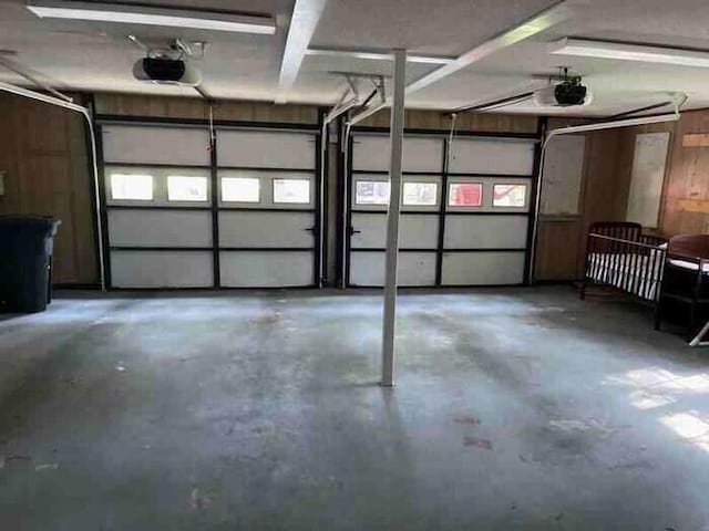 104 Legend Oaks Way, Summerville, SC 29485 - garage with wooden walls and a garage door opener