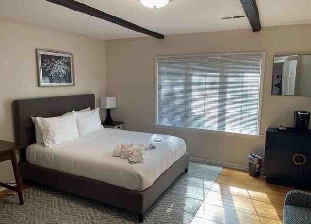 104 Legend Oaks Way, Summerville, SC 29485 - bedroom featuring beamed ceiling and wood finished floors