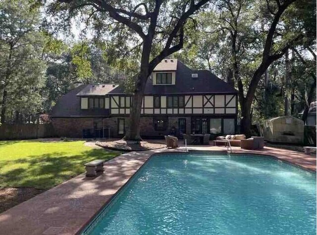 104 Legend Oaks Way, Summerville, SC 29485 - back of house with a patio area, an outdoor pool, an outdoor living space, and a lawn