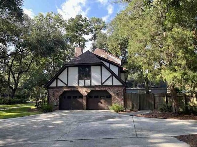 104 Legend Oaks Way, Summerville, SC 29485 - english style home with driveway, brick siding, and fence