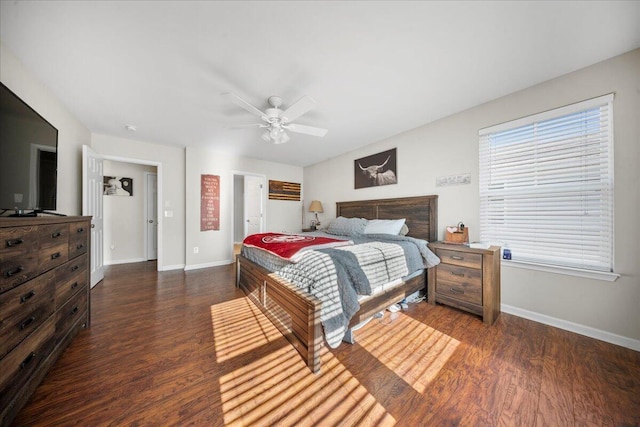 bedroom featuring baseboards, dark wood-type flooring, and ceiling fan