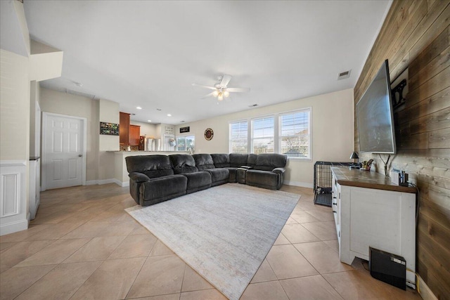 living area with baseboards, visible vents, light tile patterned flooring, recessed lighting, and ceiling fan