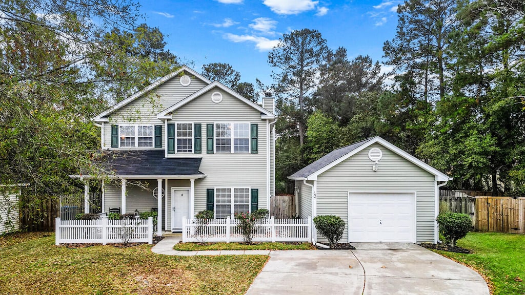 view of front of home featuring a garage and a front yard