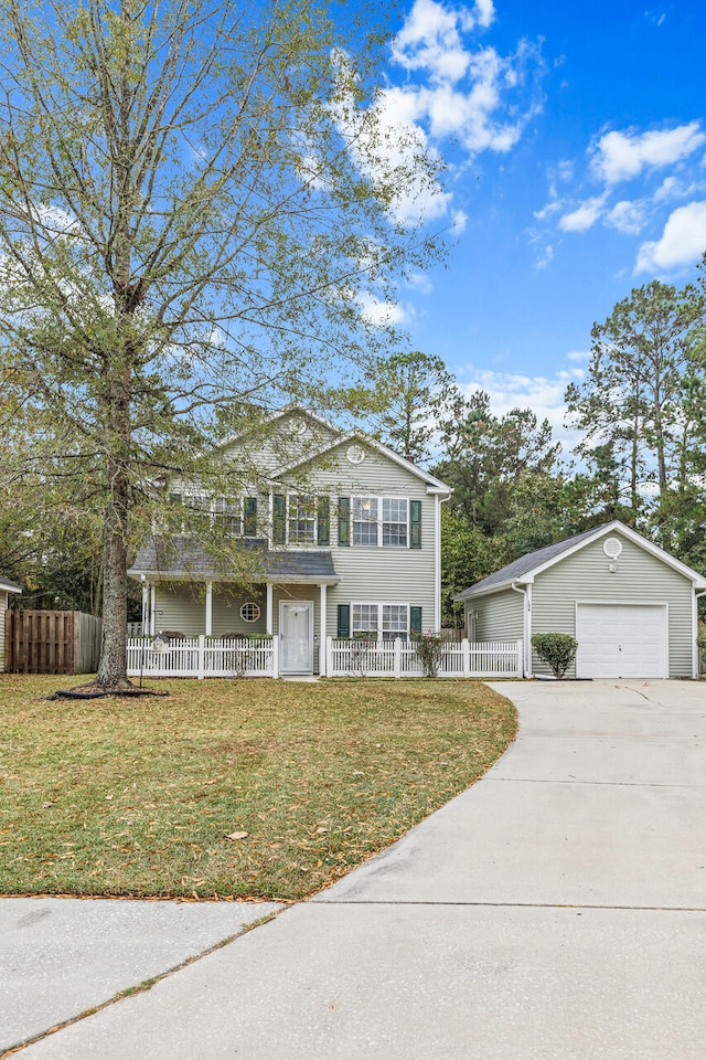 view of front of property with a garage and a front yard