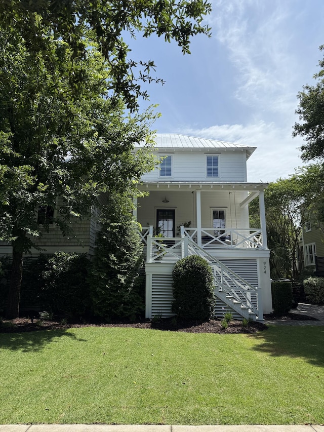 924 Mciver St, Mount Pleasant, SC 29464 - raised beach house featuring stairs, covered porch, a front lawn, and metal roof